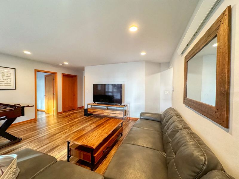 Rec room sectional and 65-inch TV